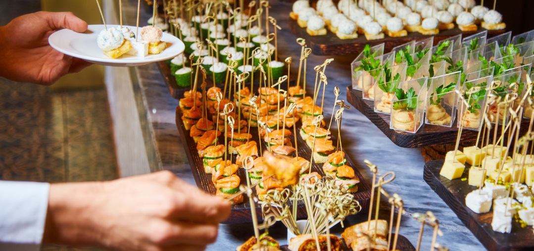 Table laid out with canapes for a reception.