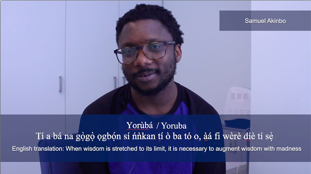 A screenshot of Samuel Akinbo saying his favourite phrase in Yoruba. The phrase is displayed in white across the bottom of the image