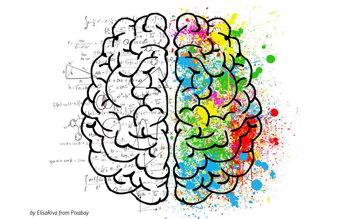 A drawing of a brain with the left side in black and white, with equations, and the right side covered with colourful paint splotches