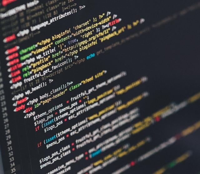 A picture of lines of multicoloured code on a computer screen