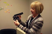 Language Sciences member professor Deborah Giaschi holds a 3D headset which is testing binocular treatment for amblyopia.