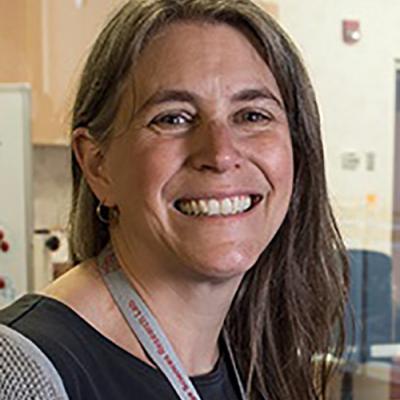 A headshot of Professor Laura Wagner smiling