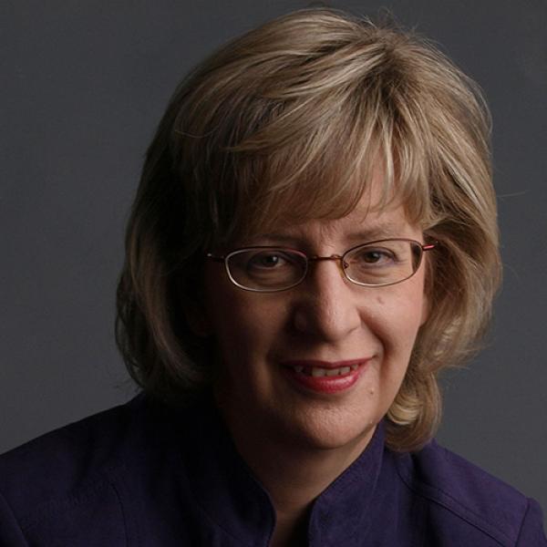 A headshot of Dr. Susan Rvachew against a grey background